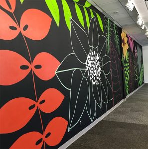 Neon floral mural on a black wall https://www.designandagency.com/moon-juice-mural